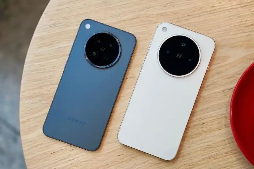 OPPO Find X8 Pro smartphones in black and white colour variants with circular Hasselblad camera module on a wooden table