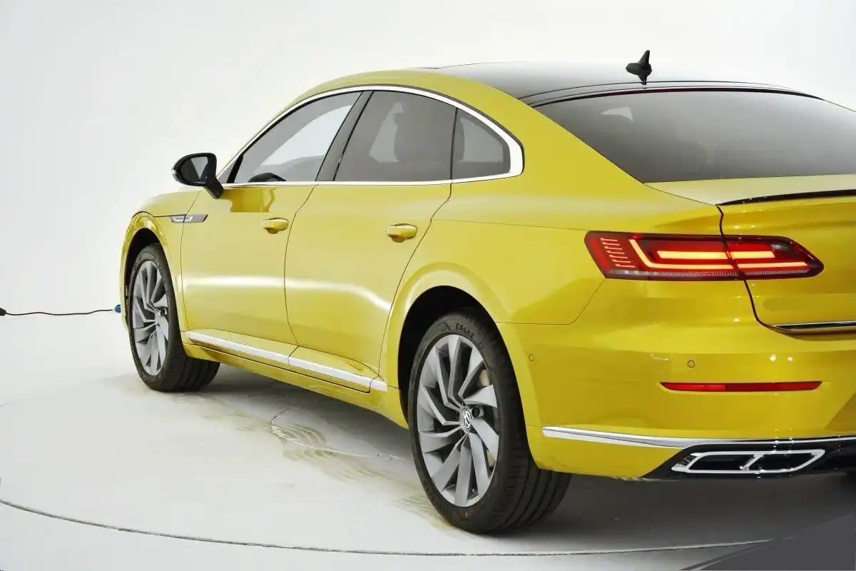 Back view of a yellow Volkswagen Arteon