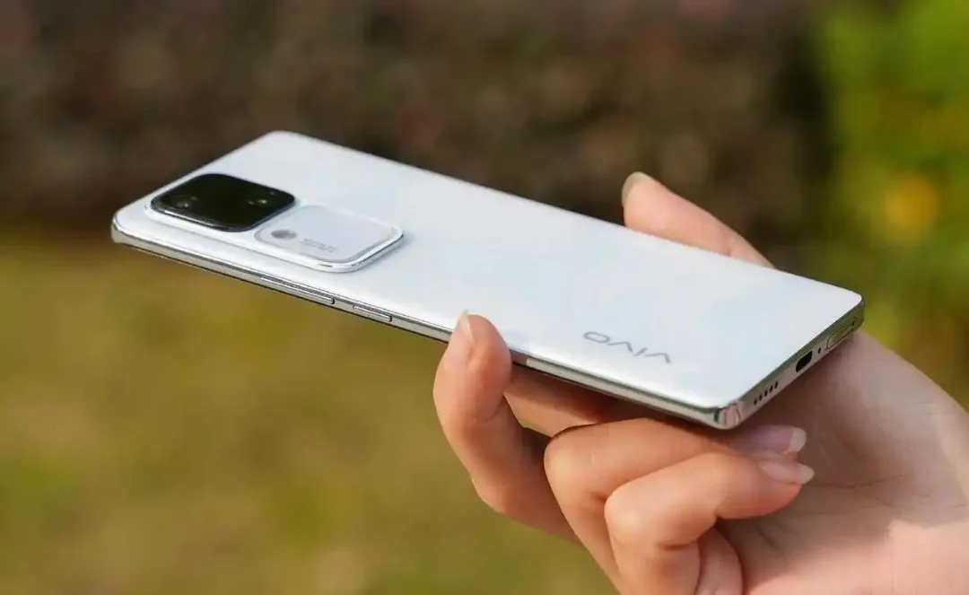 Person holding Vivo S18 in hand outdoors