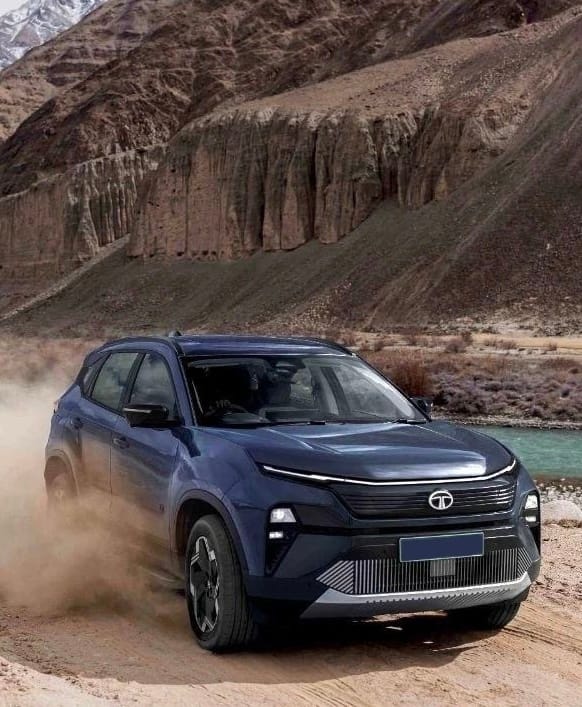 Tata Harrier EV driving on mountain trail