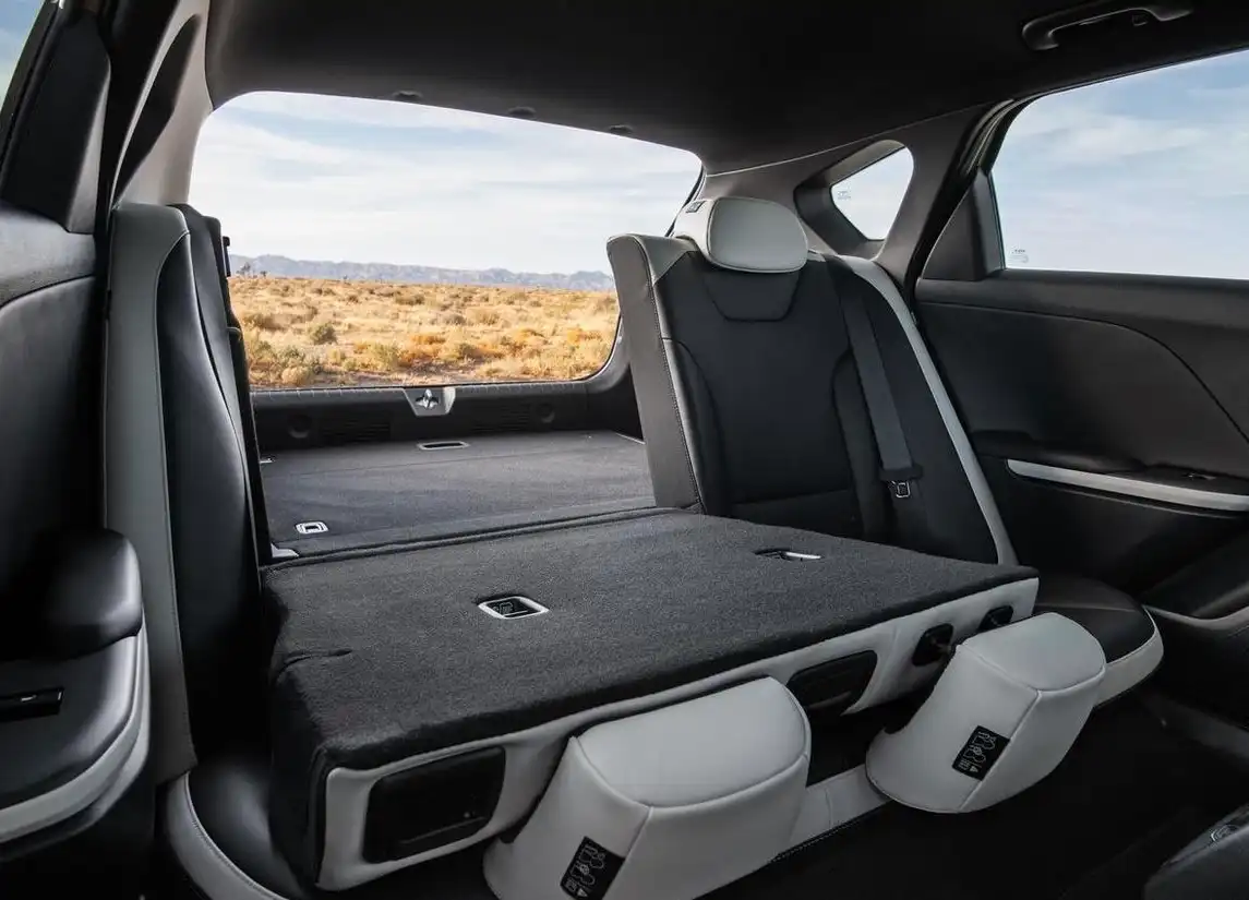 Kia K4's spacious rear with folded seats for cargo