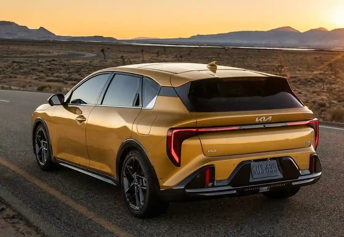 Sleek rear view of the gold Kia K4