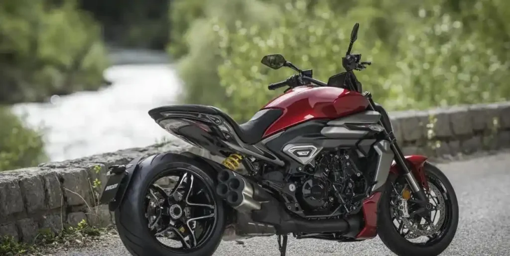 Sleek red Ducati Diavel by a nature trail