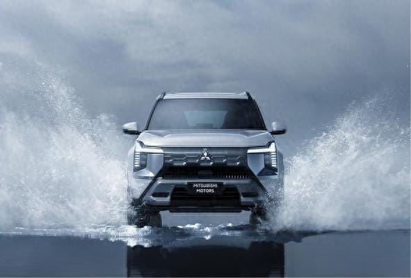 Mitsubishi Destinator SUV drives through water splashing it