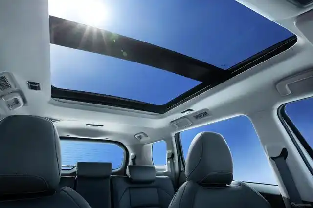 Interior view of a car showing a large panoramic sunroof