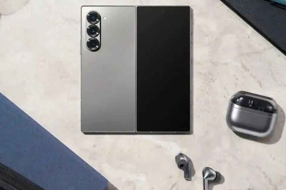 Galaxy Z Fold 6 folded next to earbuds and case