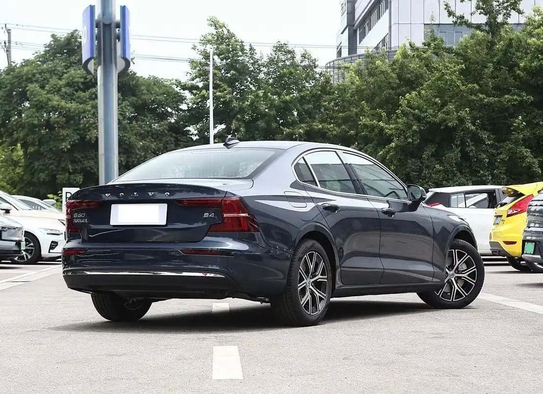 Rear view of 2025 Volvo S60 parked in showroom lot