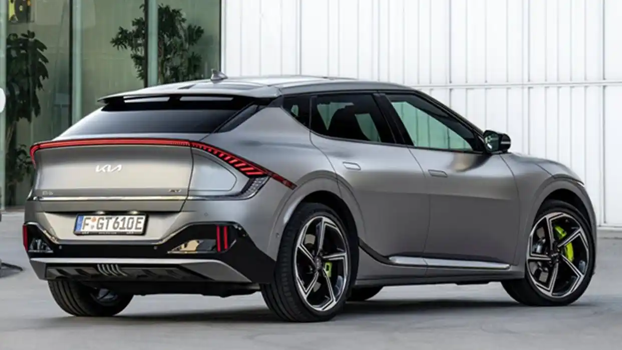 2025 Kia EV6 GT high-performance electric SUV parked near a glass building