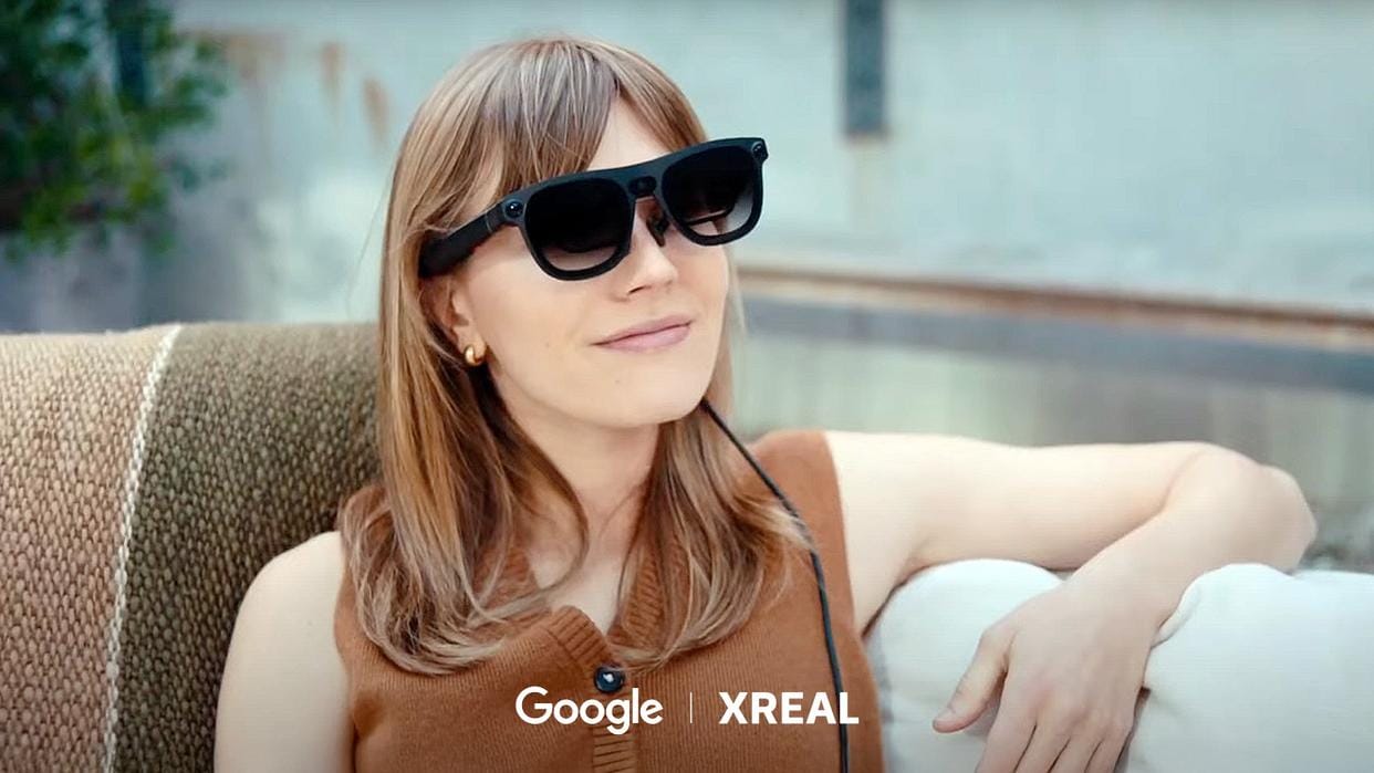 Woman wearing XREAL One Pro AR glasses outside