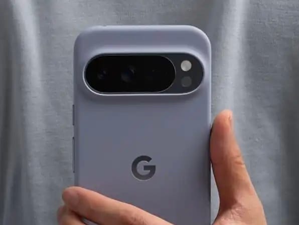 A hand holds a Google Pixel smartphone with a light purple case