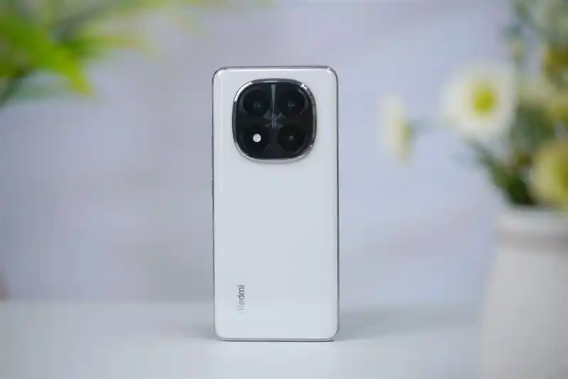 The back of a white Redmi Note 14 Pro Plus