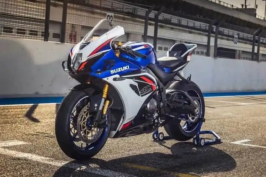 2025 Suzuki GSX-R1000R parked on racetrack in anniversary livery