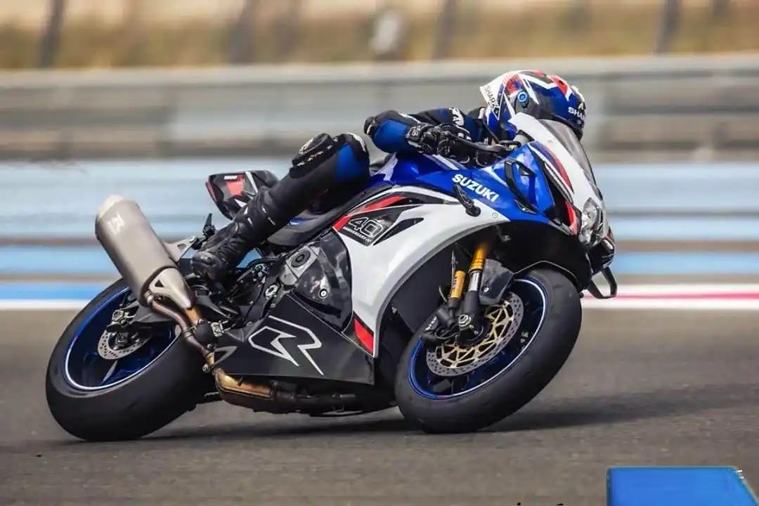 2025 Suzuki GSX-R1000 superbike cornering on race track at high speed