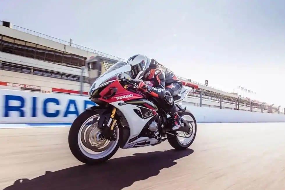 Suzuki GSX-R1000R 40th Anniversary racing on track in red and white