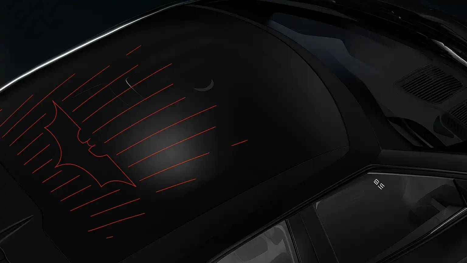 The black roof of the Mahindra BE 6 features a prominent red Batman symbol