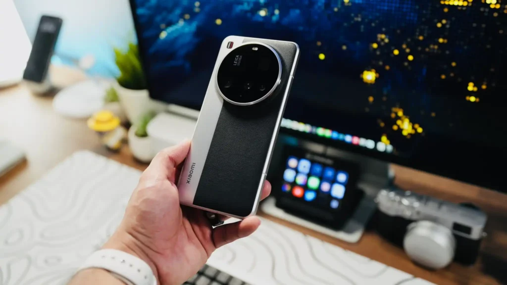 Hand holding Xiaomi 15 Ultra smartphone with Leica camera module and premium leather finish design.