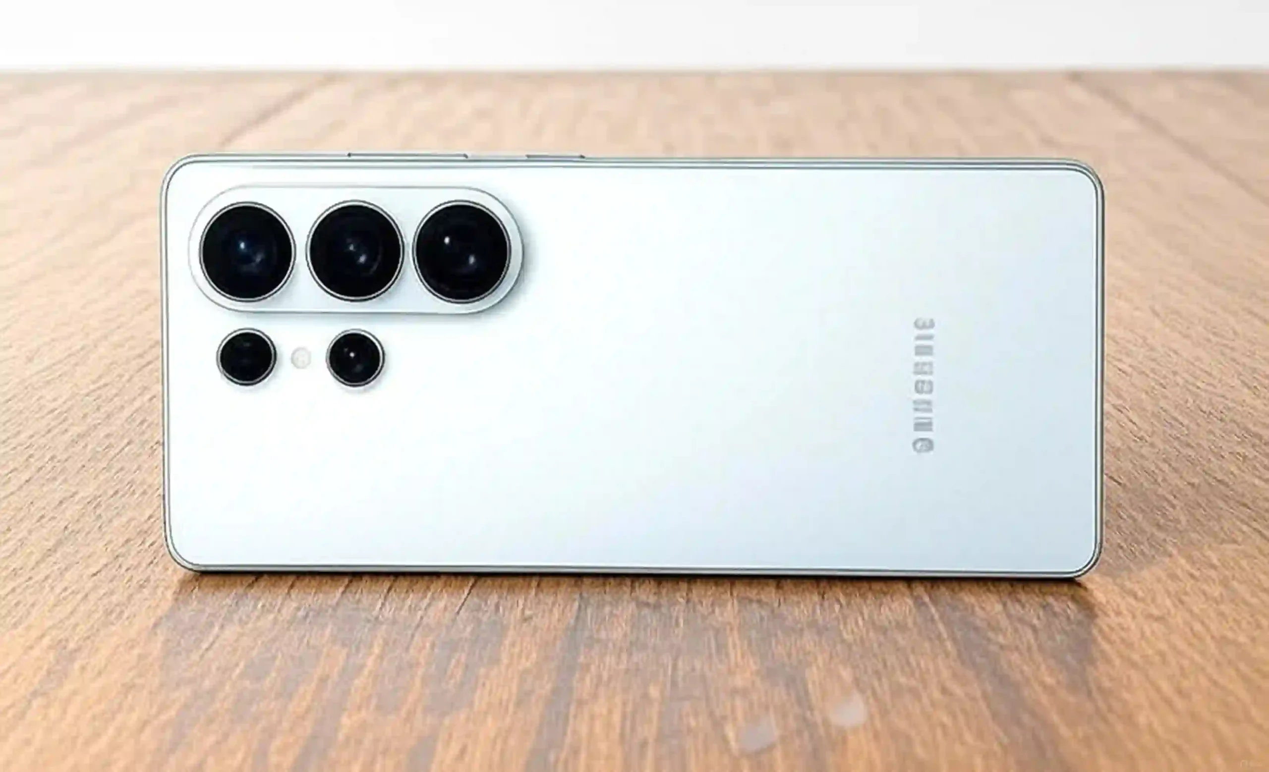 Samsung Galaxy S26 Ultra in white, showing the rear with its quad camera lenses