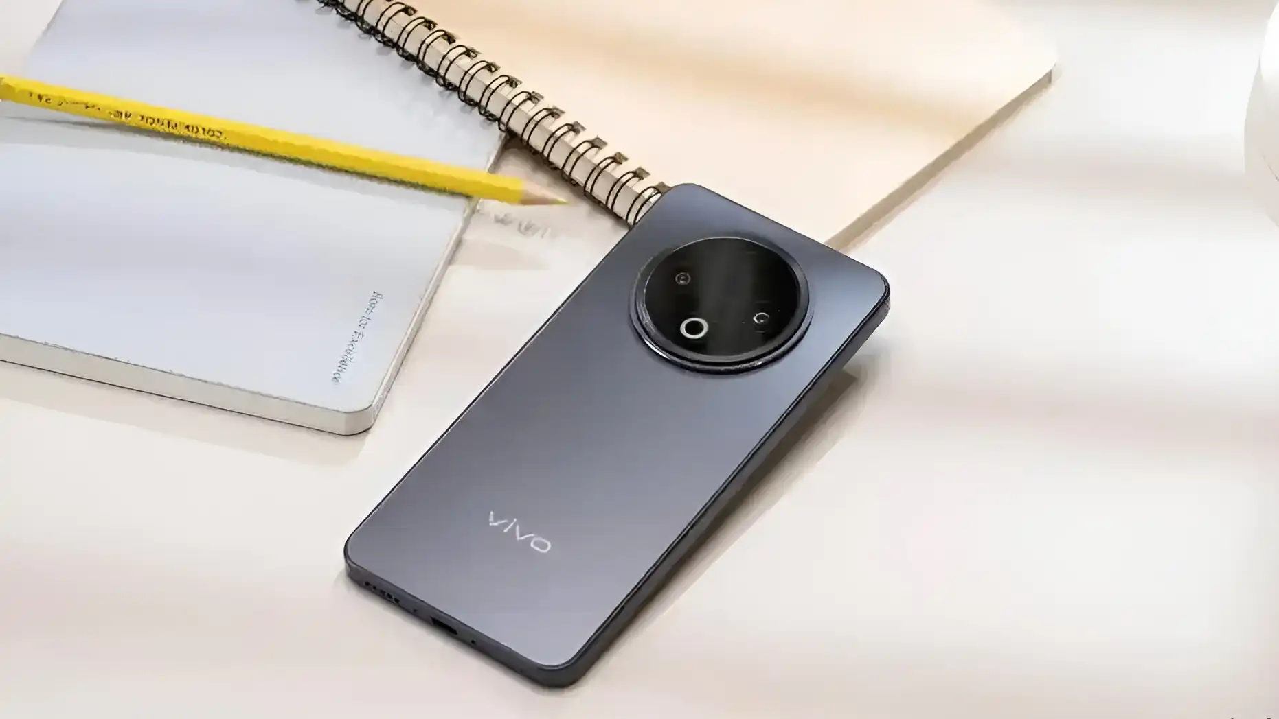 A close-up shot of the Vivo Y500 smartphone in gray, showcasing its camera module and sleek design.