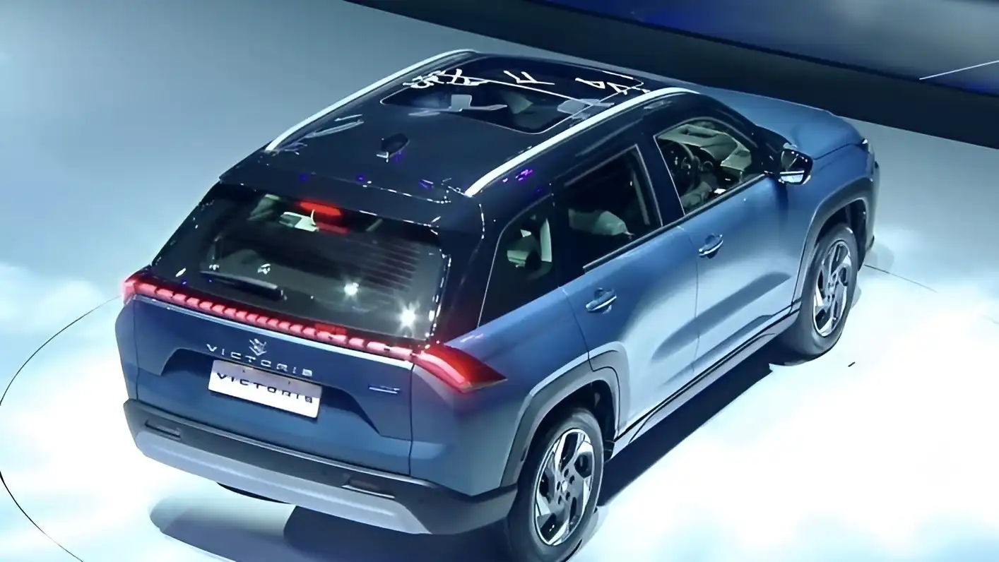 Rear view of Maruti Suzuki Victoris SUV showcasing LED tail lamps and panoramic sunroof