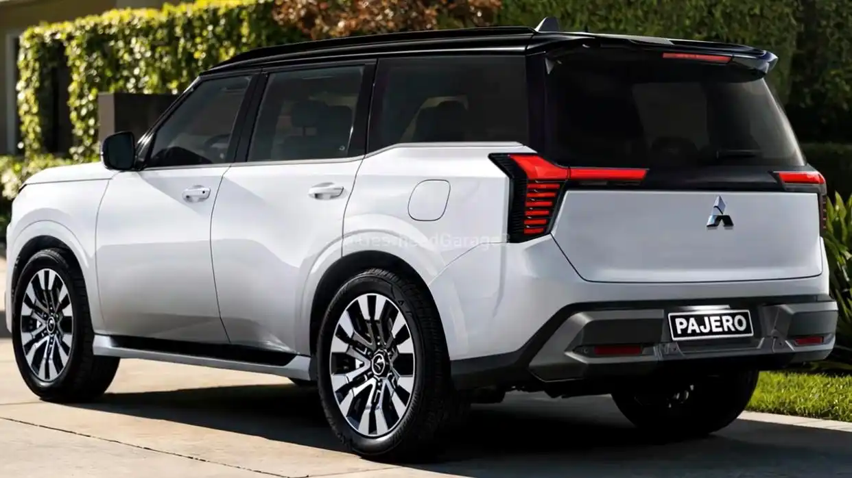The rear three-quarter view of the new white 2026 Mitsubishi Pajero SUV, showing its modern upright LED taillights and rugged design.