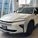 New generation Toyota Crown SUV in white showcased at dealership with modern design