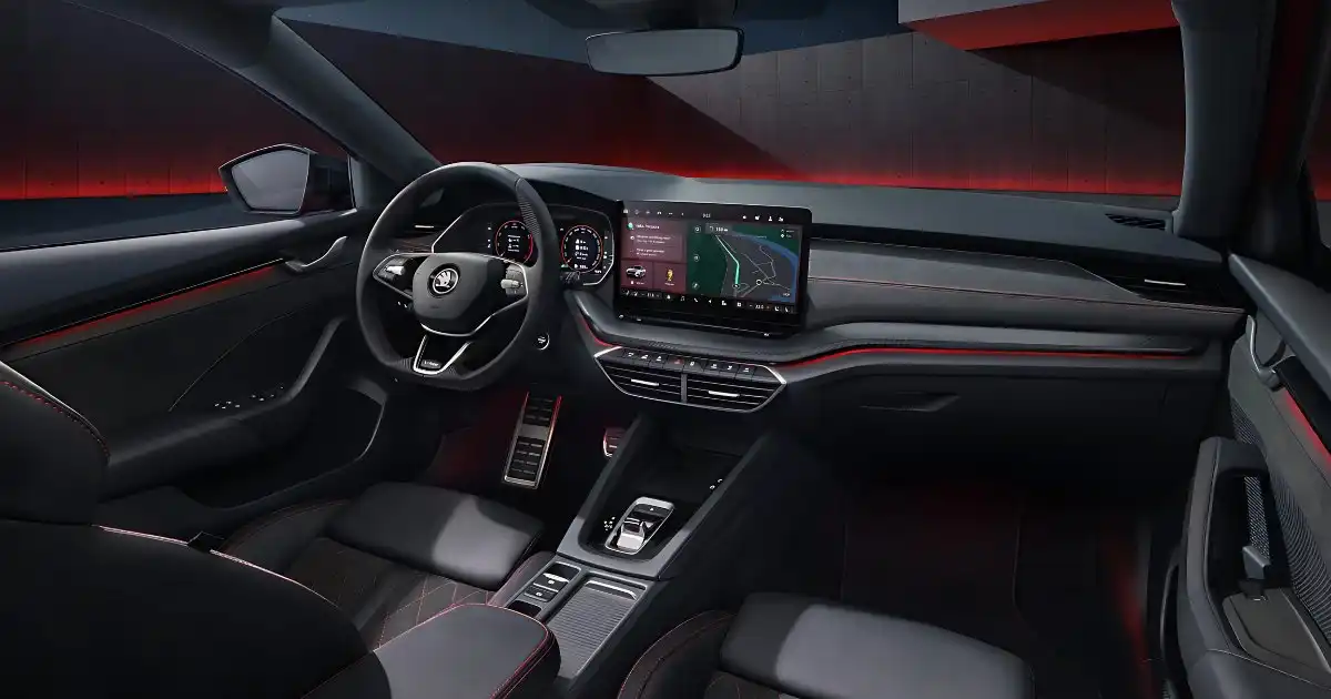 Interior of the 2025 skoda Octavia RS showing the black cabin, red stitching, and 13-inch screen.