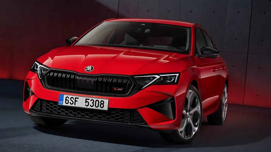 Close-up front view of the red 2025 Škoda Octavia RS, showing the black grille and bumper.
