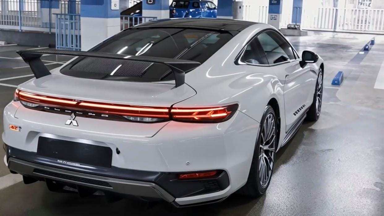 2026 Mitsubishi Lancer rear view with LED taillights, sporty spoiler, and coupe-inspired design